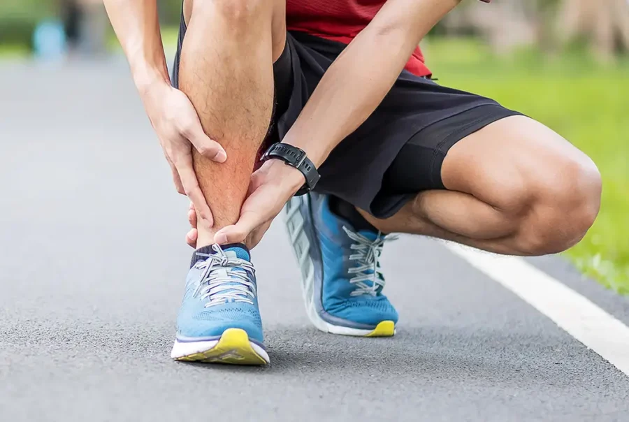 adult-man-massaging-sore-ankle-after-run